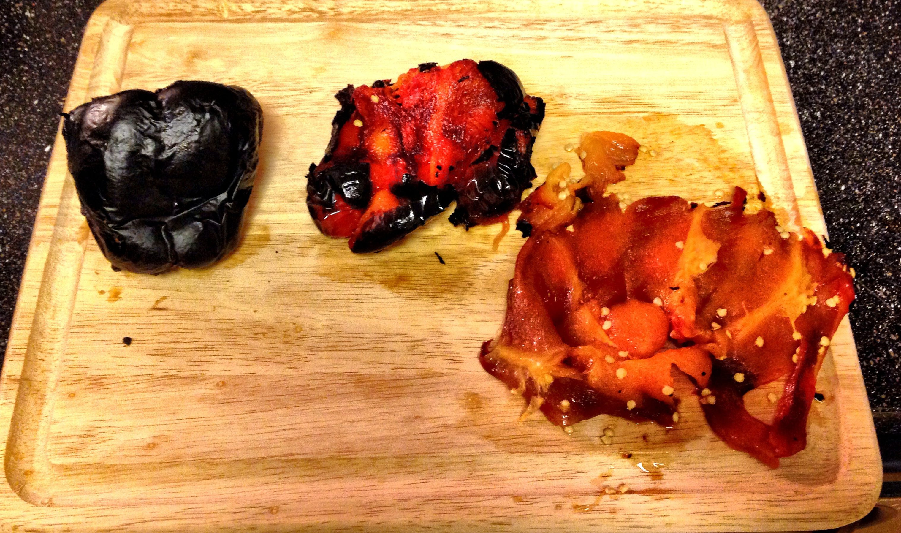 Step Four: Peel off blackened skin, slice peppers open, scrape out the seeds and discard.